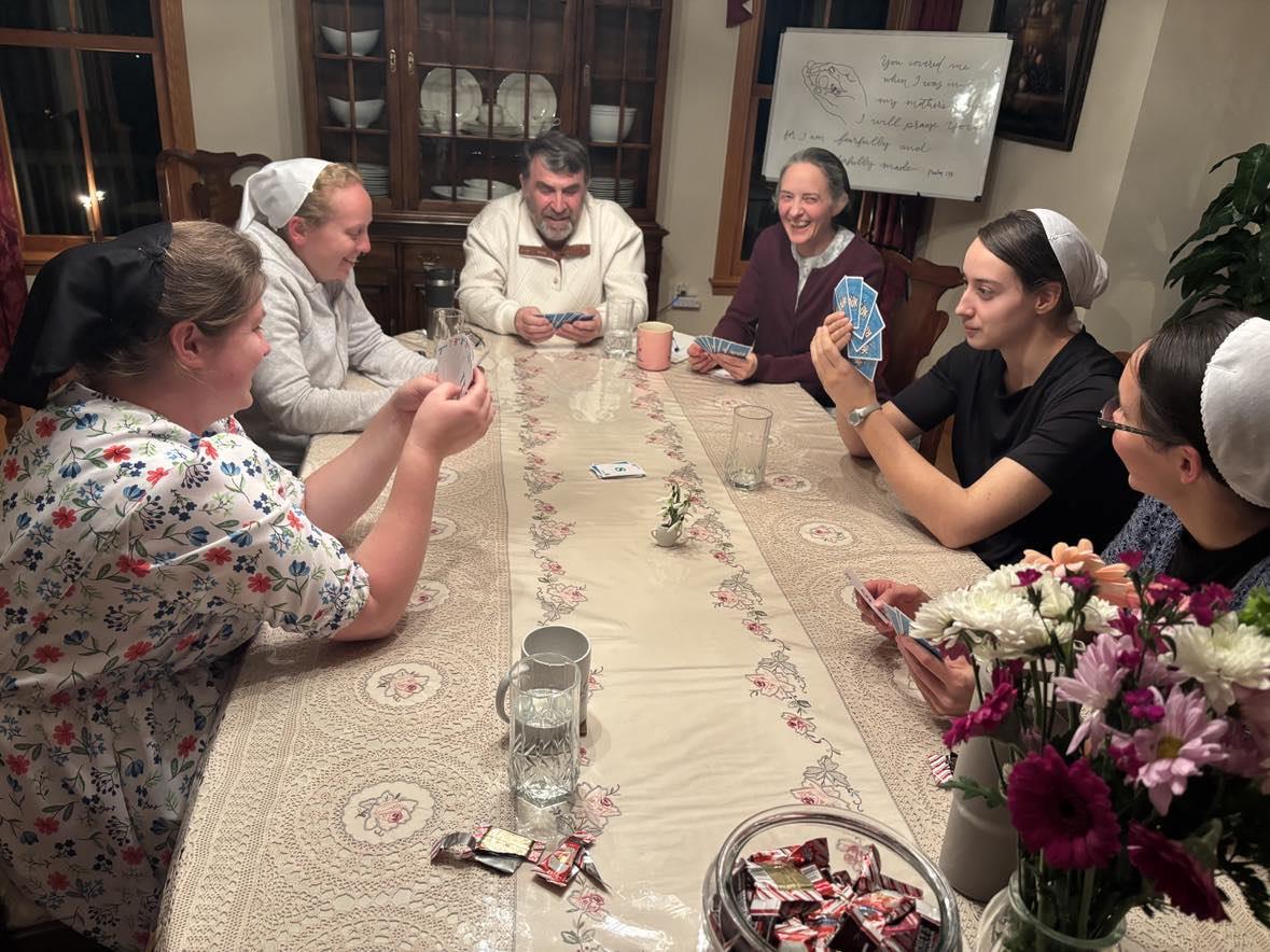 Community card game evening at Stories Made New