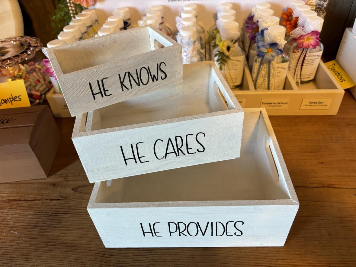 He Knows, He Cares, He Provides, stacked wooden crates