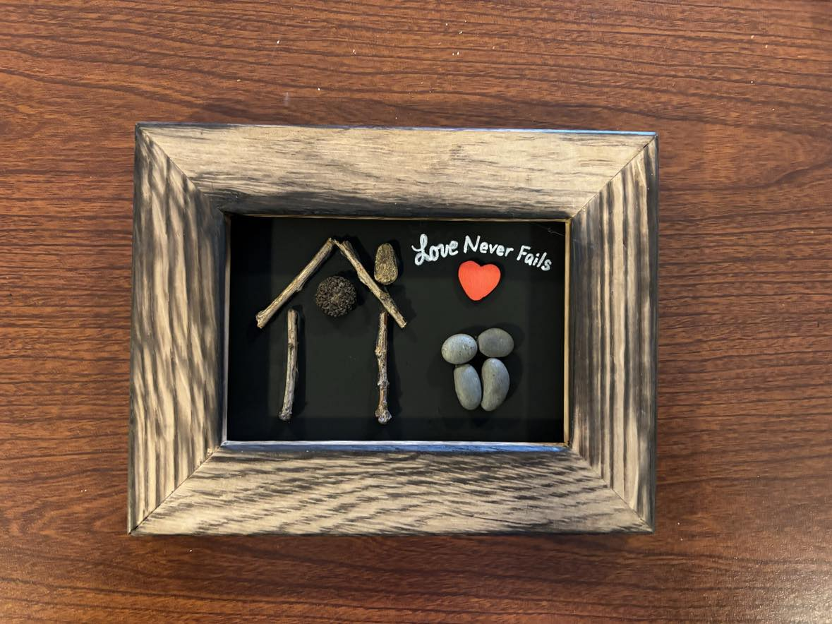 Love Never Fails, pebble art with heart