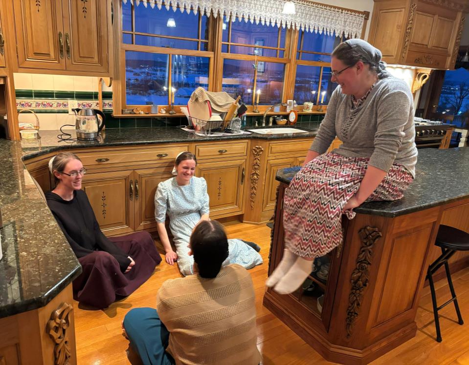 Women laughing together in the kitchen