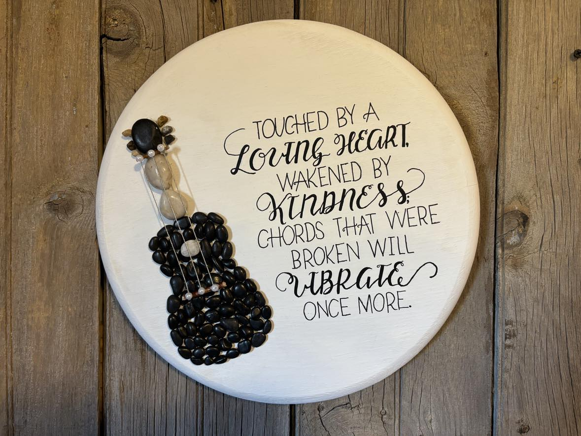 Touched by a loving heart pebble art
